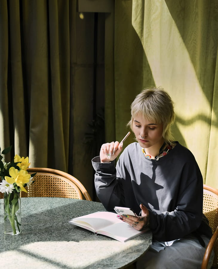 A founder setting strategy at a table on day one of the DONE five-day accelerator.