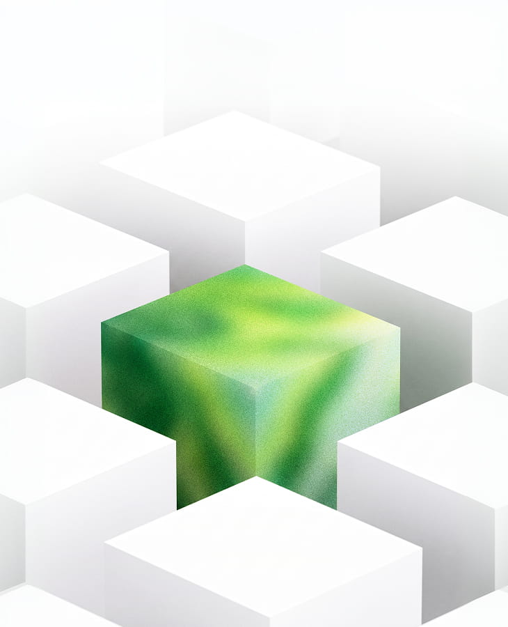 A single green block standing proud of the white blocks around it — the product taking shape on build day.